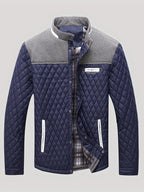 Men's navy quilted jacket with tweed trim, front view