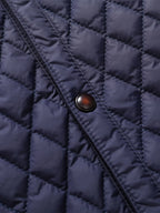 Men's black quilted jacket, button and quilting detail
