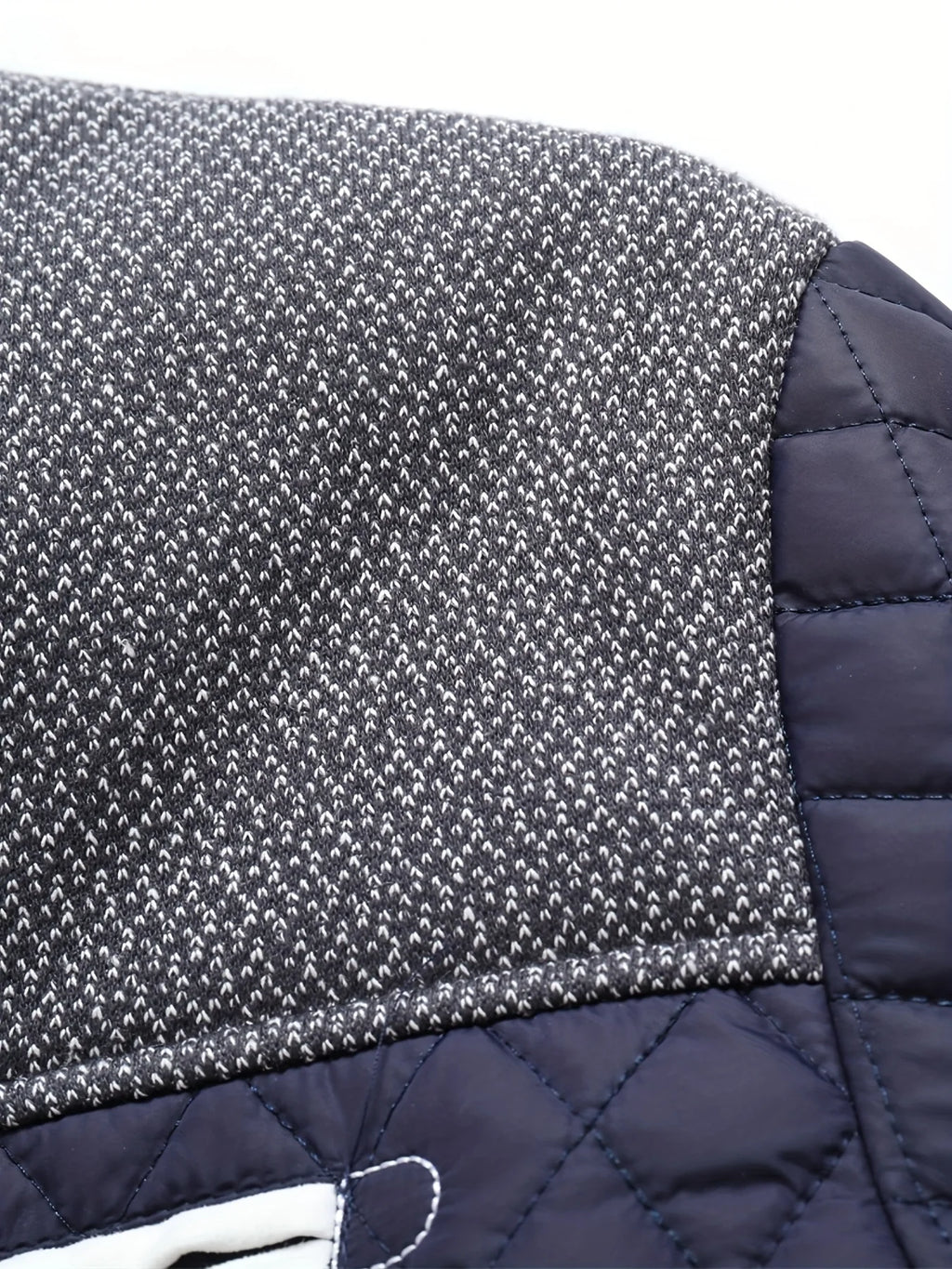 Men's black quilted jacket, tweed yoke fabric detail