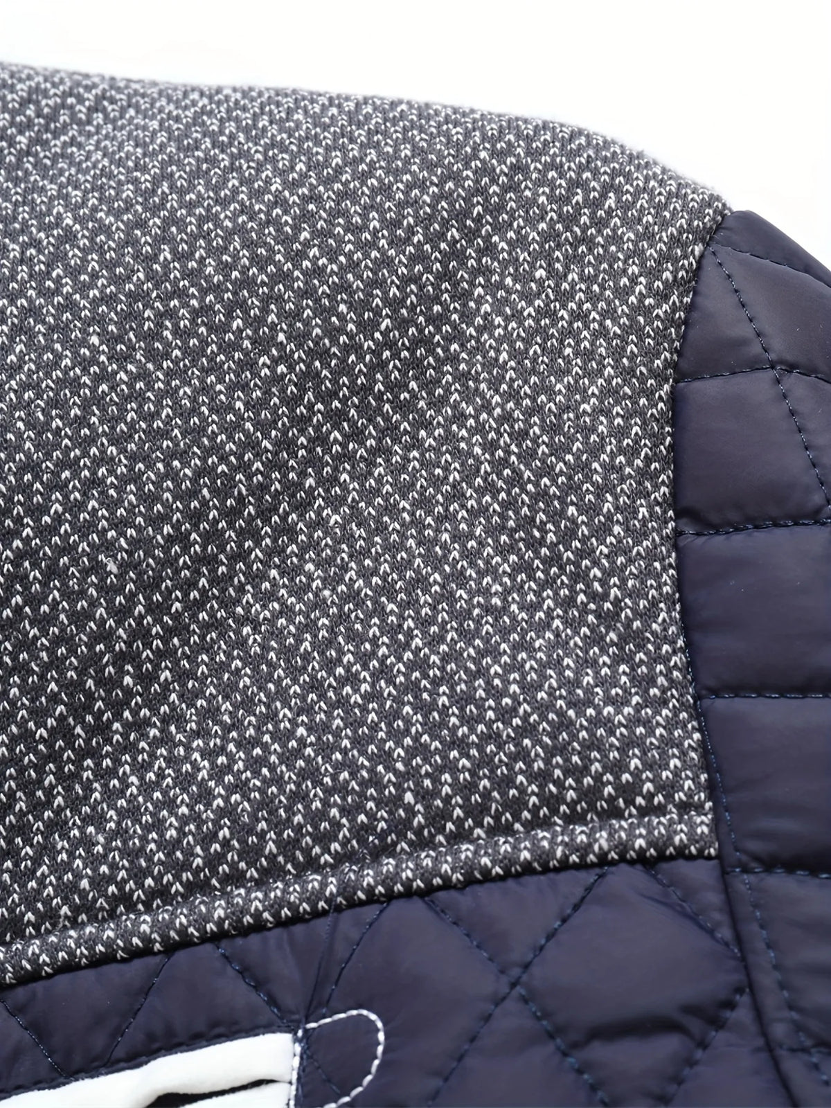 Men's black quilted jacket, tweed yoke fabric detail