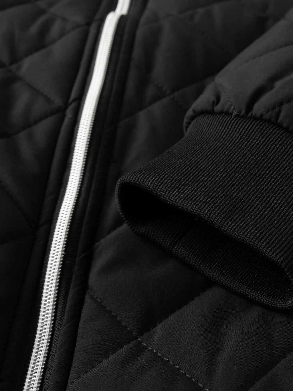 Men's black relaxed-fit quilted bomber jacket with zip pocket