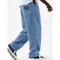 Men's sky blue ribbed knit wide-leg sweatpants, side view