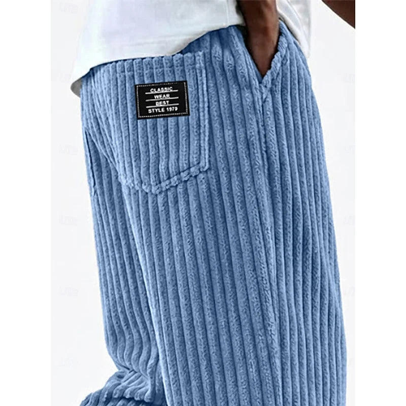 Close-up of sky blue ribbed knit fabric on men's wide-leg sweatpants