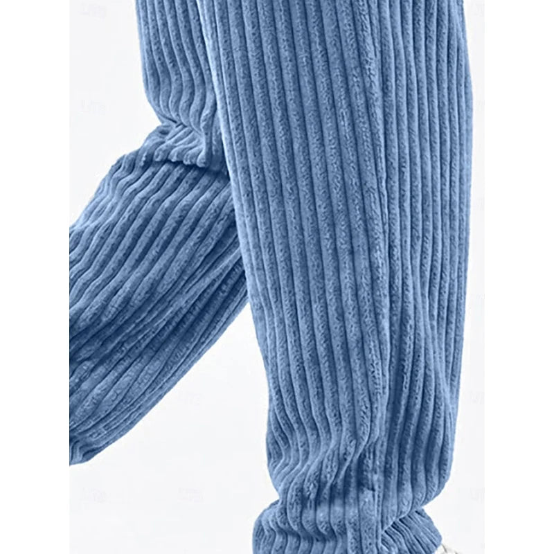 Detail view of sky blue ribbed knit wide-leg sweatpants cuff
