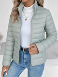 Women's green lightweight quilted jacket with tailored fit