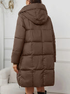 Women's reddish brown hooded longline puffer coat with full-length zip