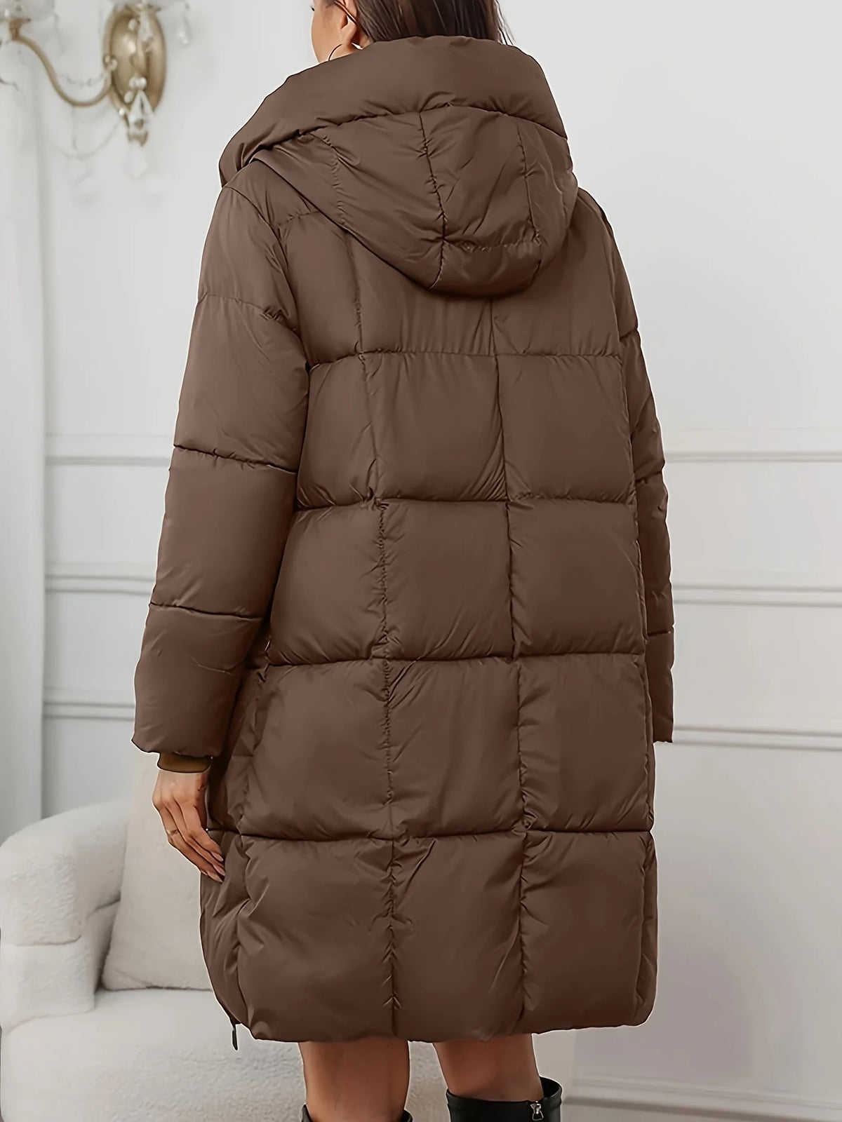 Women's reddish brown hooded longline puffer coat with full-length zip