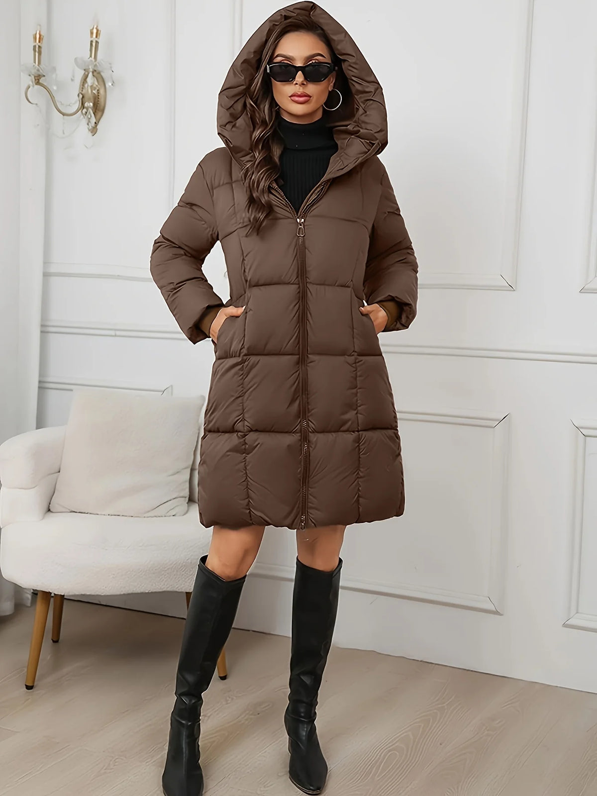 Women's reddish brown hooded longline puffer coat with full-length zip