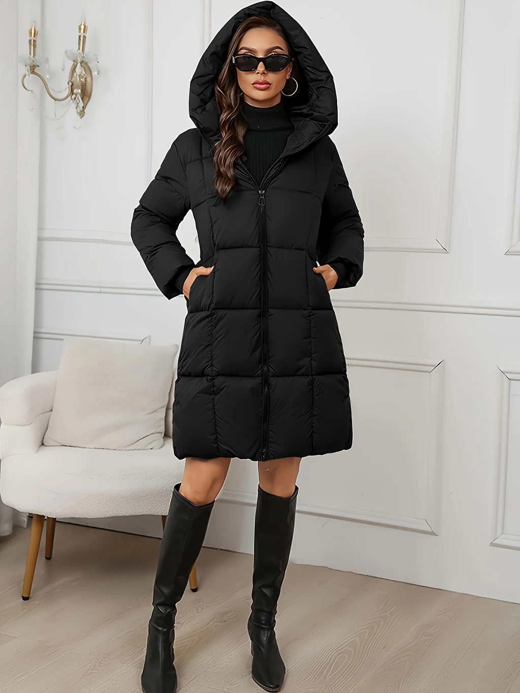 Women's black hooded longline puffer coat with full-length zip