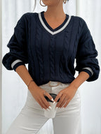 Women's navy cable-knit v-neck sweater for layering, with ribbed trim