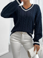 Women's navy cable-knit v-neck sweater for layering, with ribbed trim