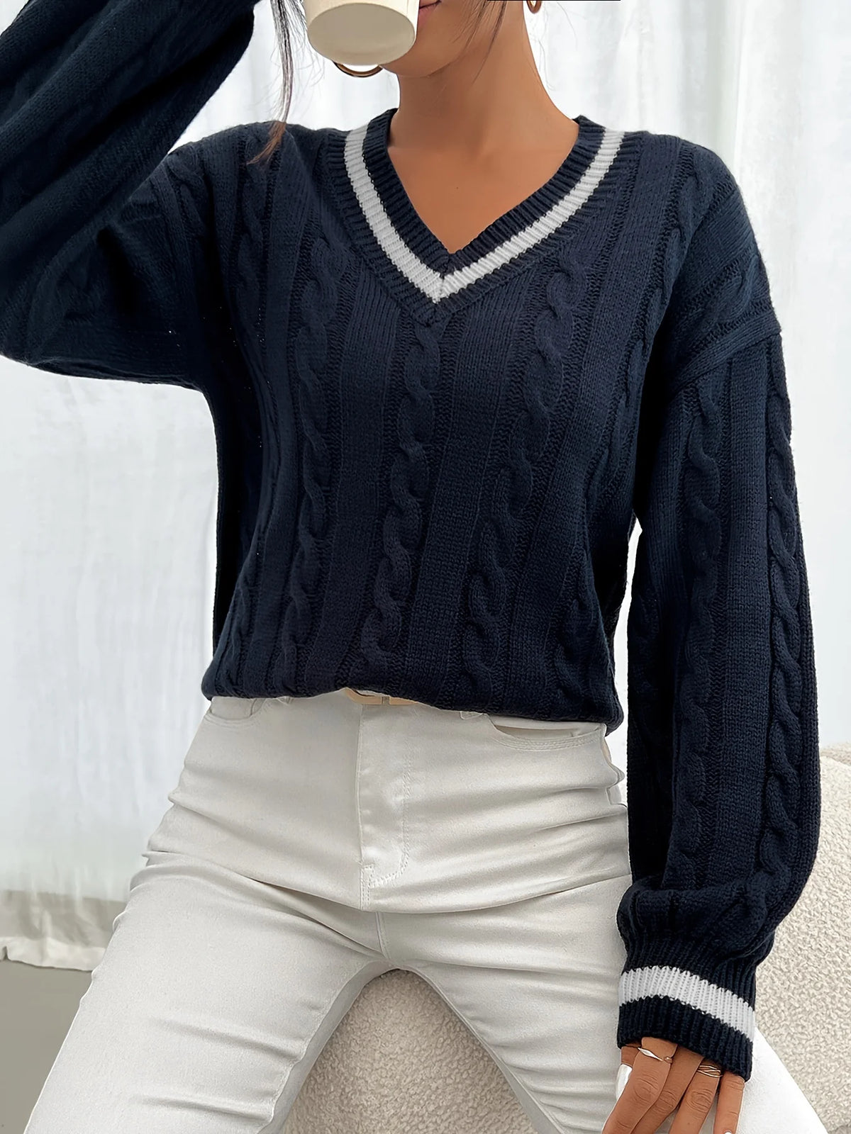 Women's navy cable-knit v-neck sweater for layering, with ribbed trim