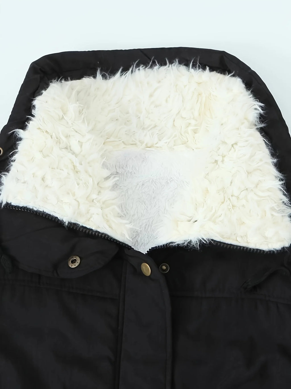 Women's black faux fur-trimmed hooded winter parka, fur hood lining detail