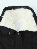 Women's black faux fur-trimmed hooded winter parka, fur hood lining detail