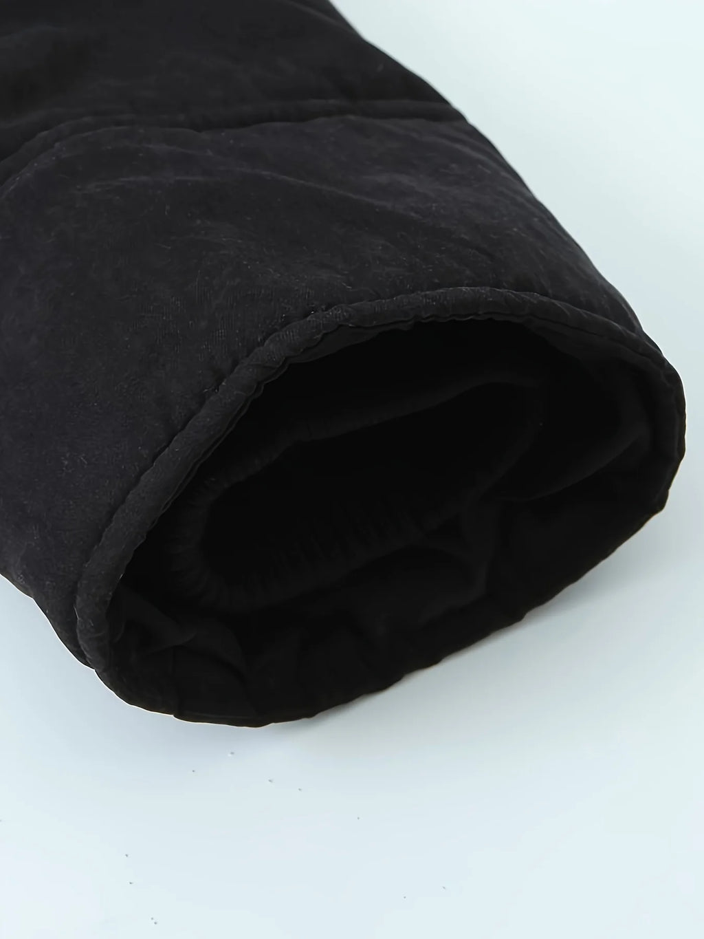 Women's black faux fur-trimmed hooded winter parka, sleeve cuff detail