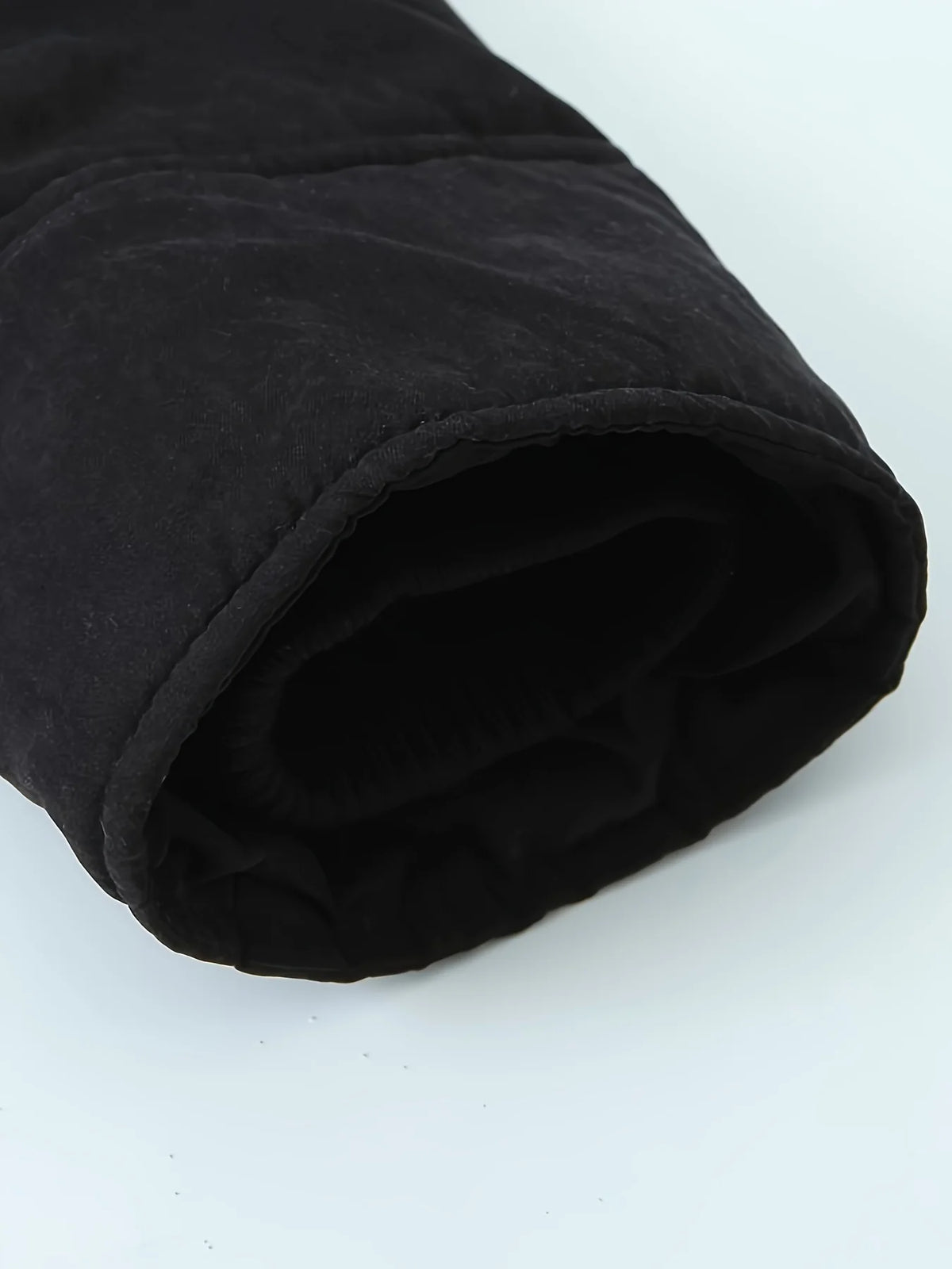 Women's black faux fur-trimmed hooded winter parka, sleeve cuff detail