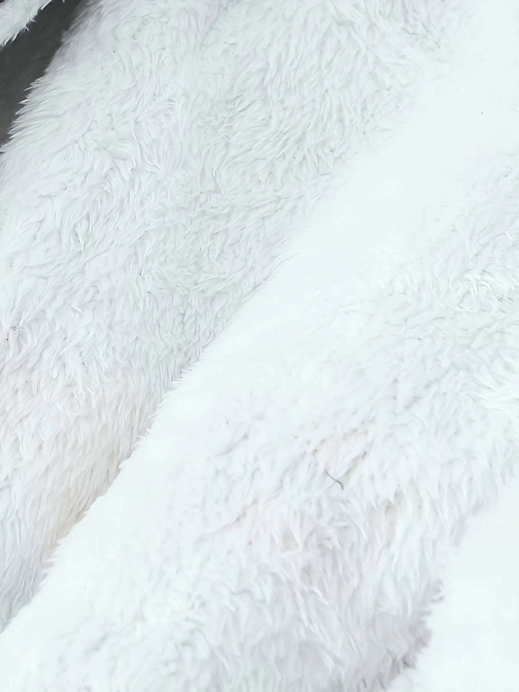 Women's black faux fur-trimmed hooded winter parka, faux fur texture detail