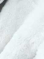 Women's black faux fur-trimmed hooded winter parka, faux fur texture detail