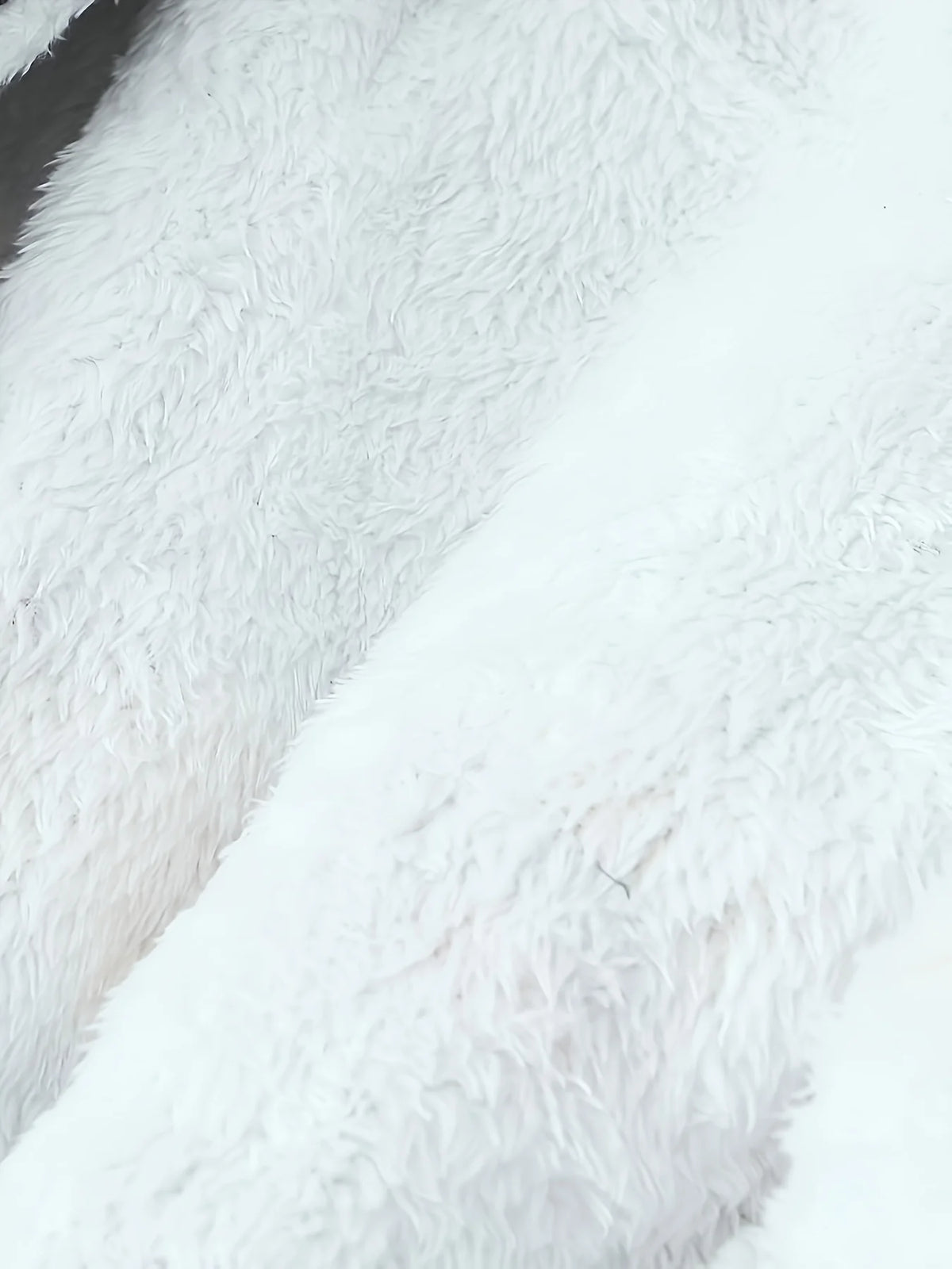 Women's black faux fur-trimmed hooded winter parka, faux fur texture detail