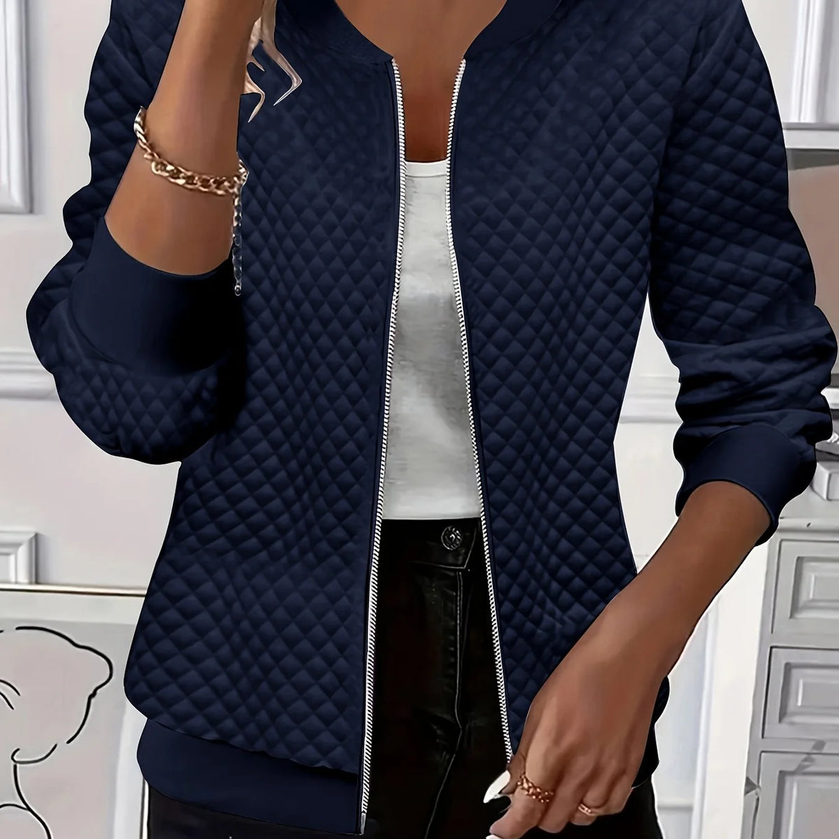 Women's navy quilted bomber jacket with ribbed collar