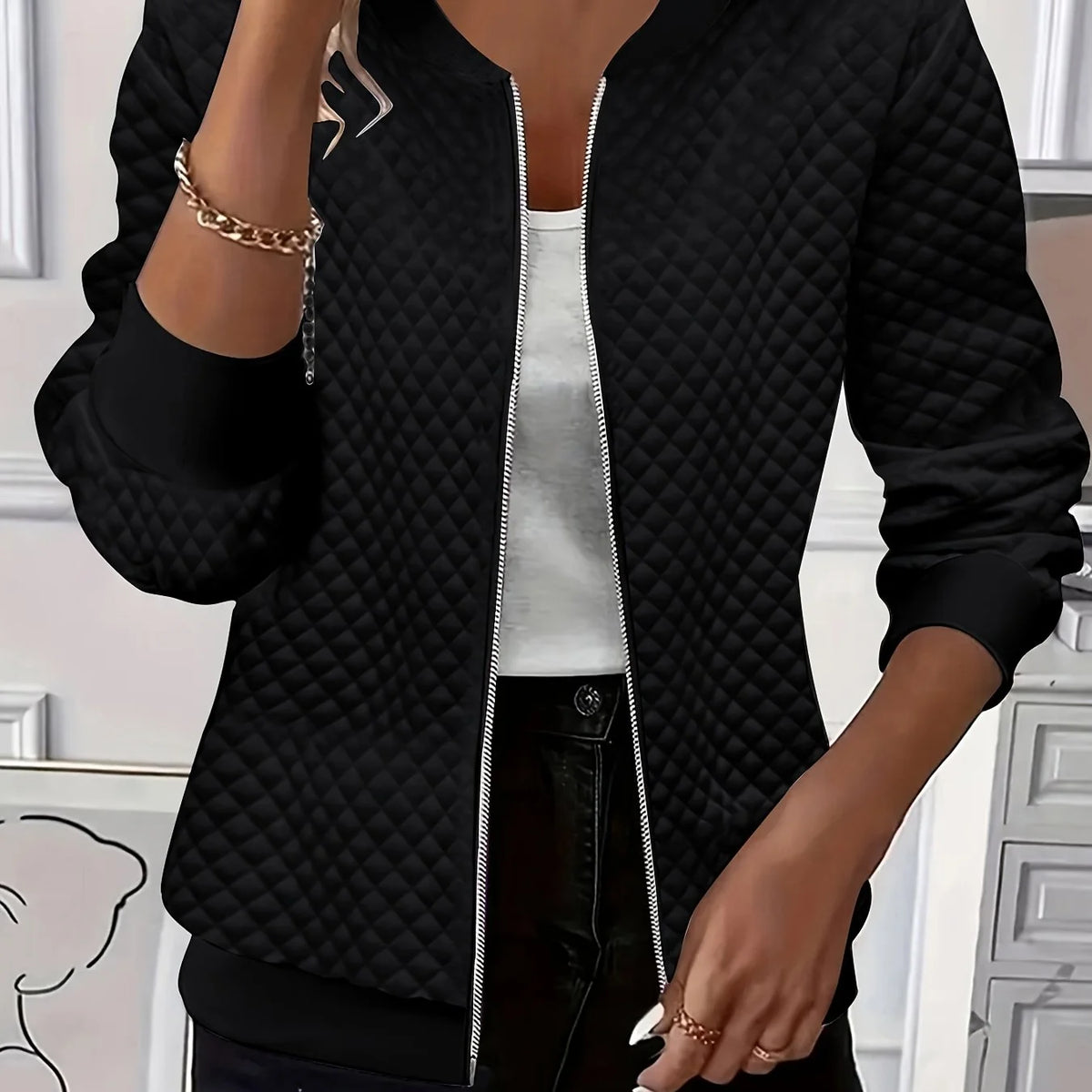 Women's black quilted bomber jacket with ribbed collar