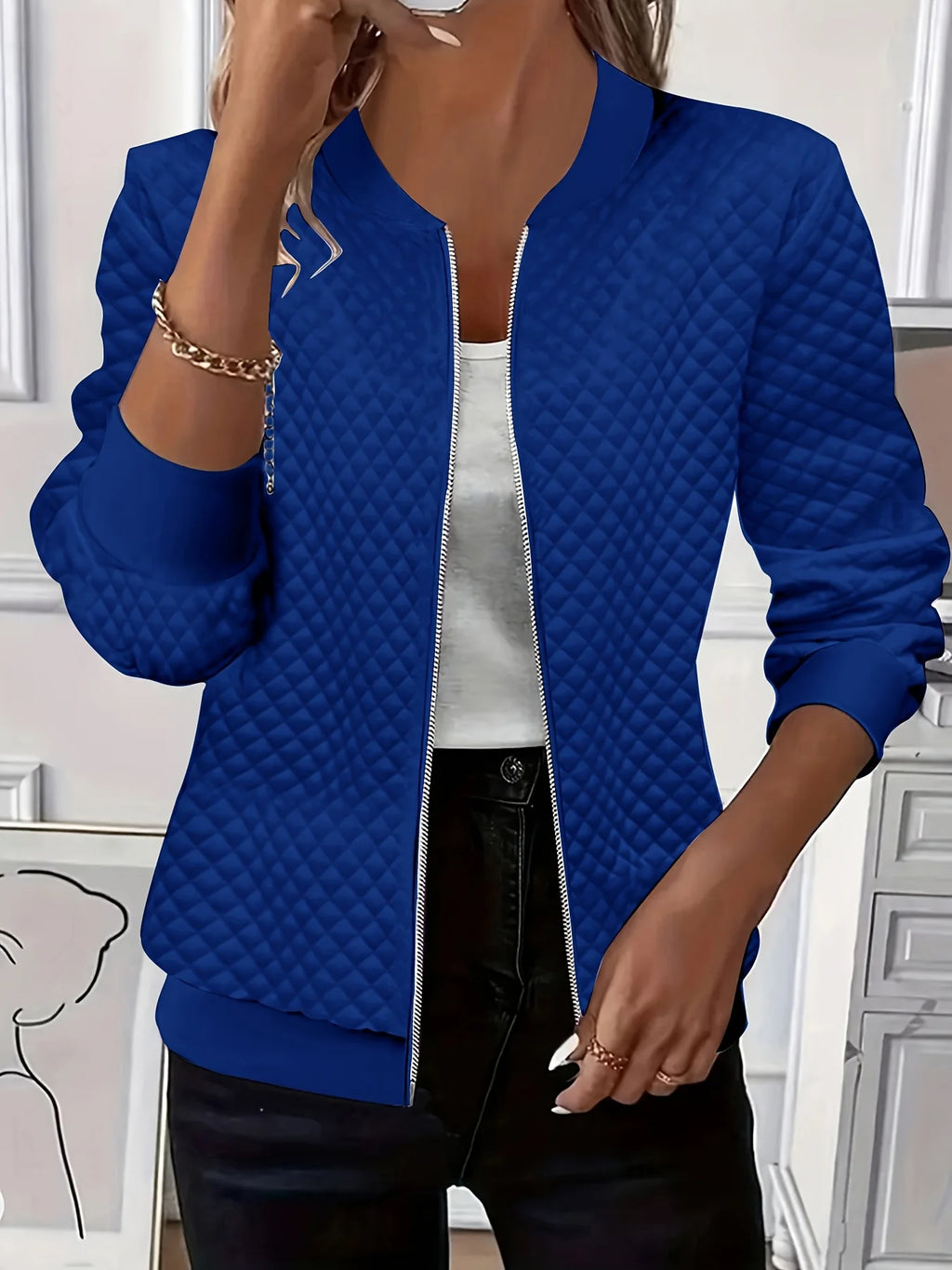 Women's blue quilted bomber jacket with ribbed collar