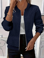 Women's navy quilted bomber jacket with ribbed collar