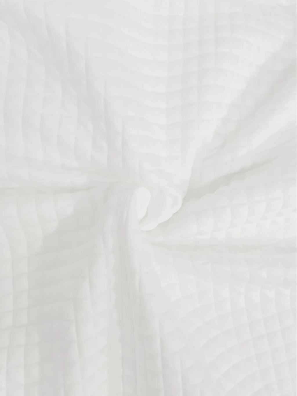 Women's white quilted bomber jacket fabric detail