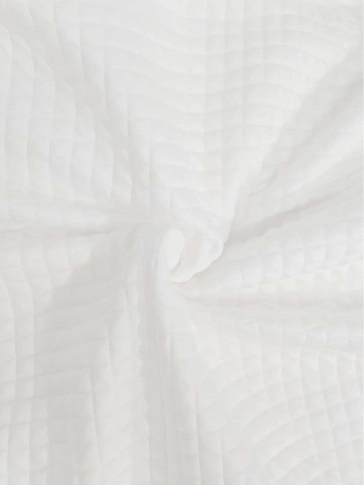 Women's white quilted bomber jacket fabric detail