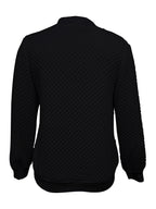 Women's black quilted bomber jacket fabric detail