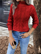 Women's black chunky cable knit turtleneck sweater, front view