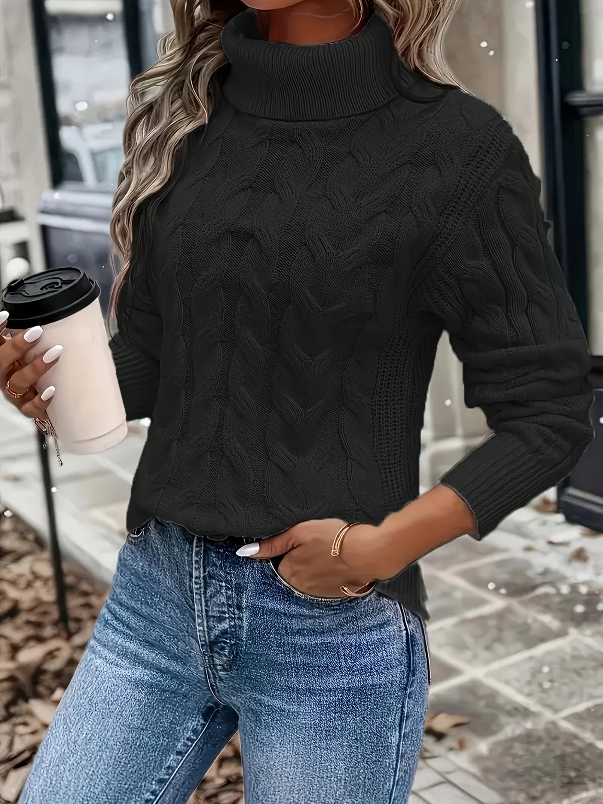 Women's black chunky cable knit turtleneck sweater, back view