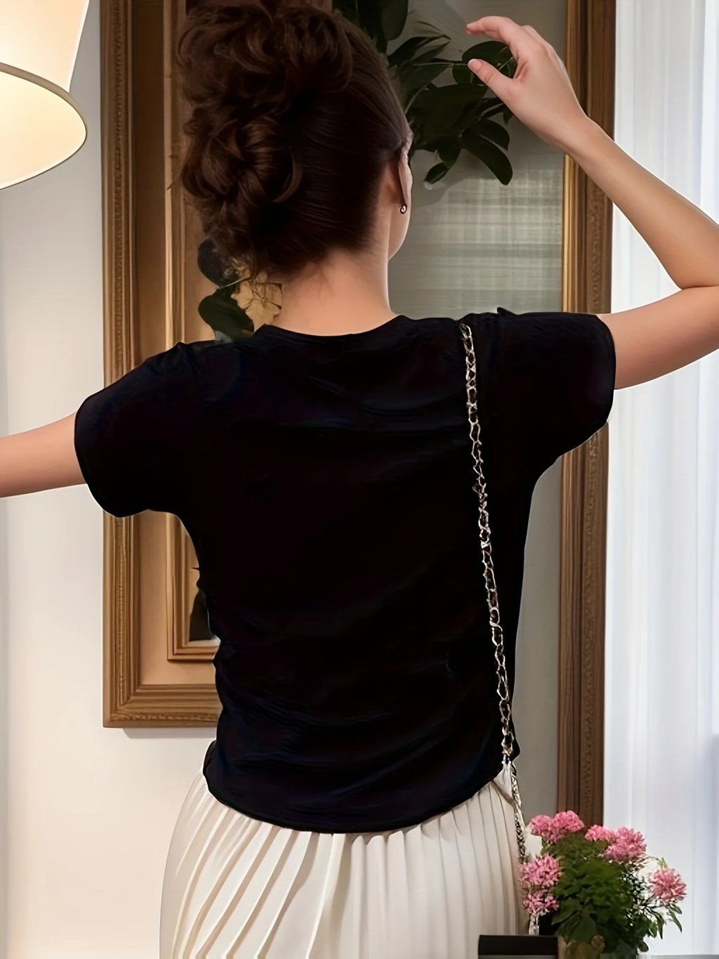 Women's black ribbed mock neck top, fitted short sleeve style