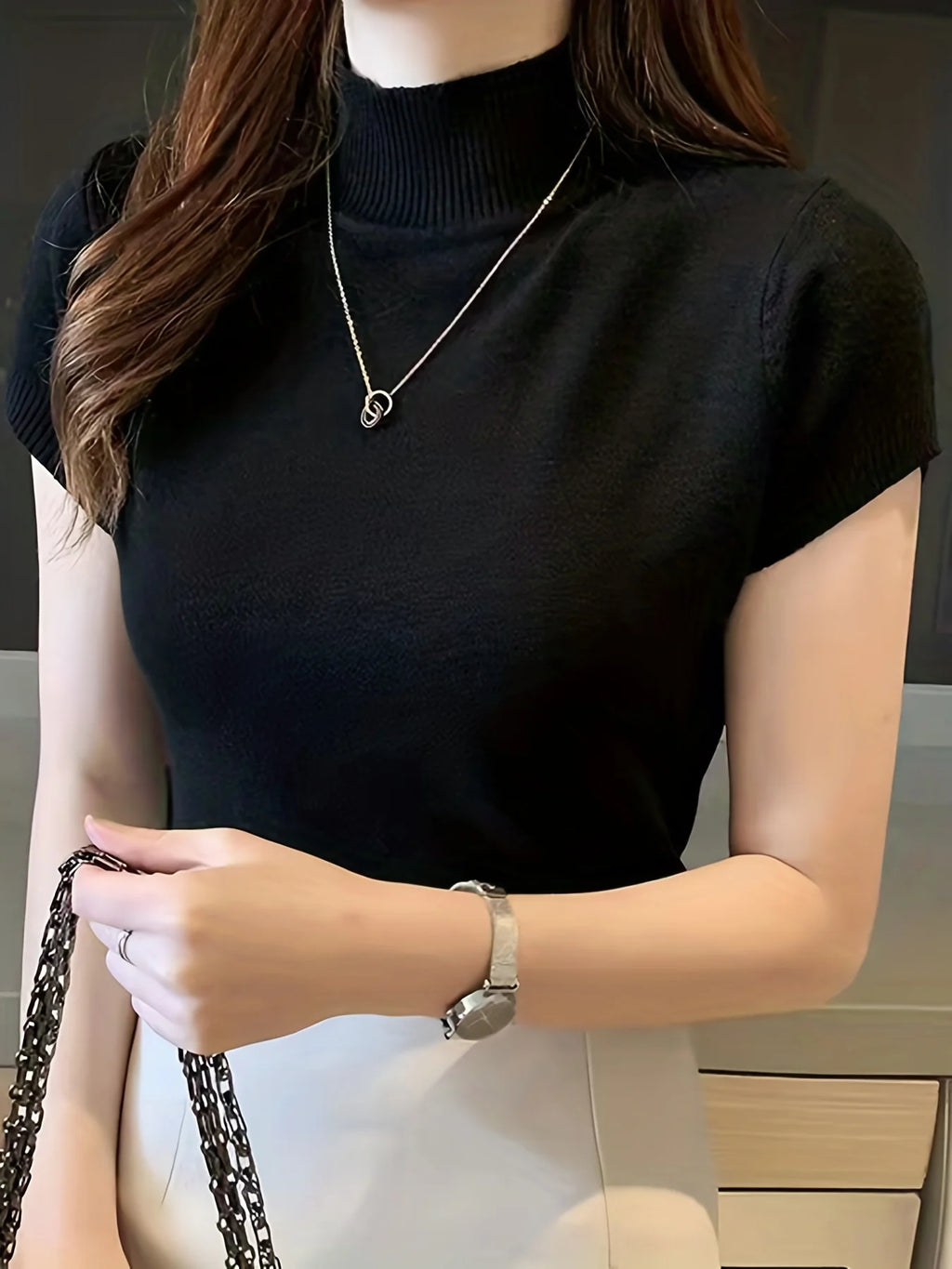 Women's black ribbed mock neck top, fitted short sleeve style