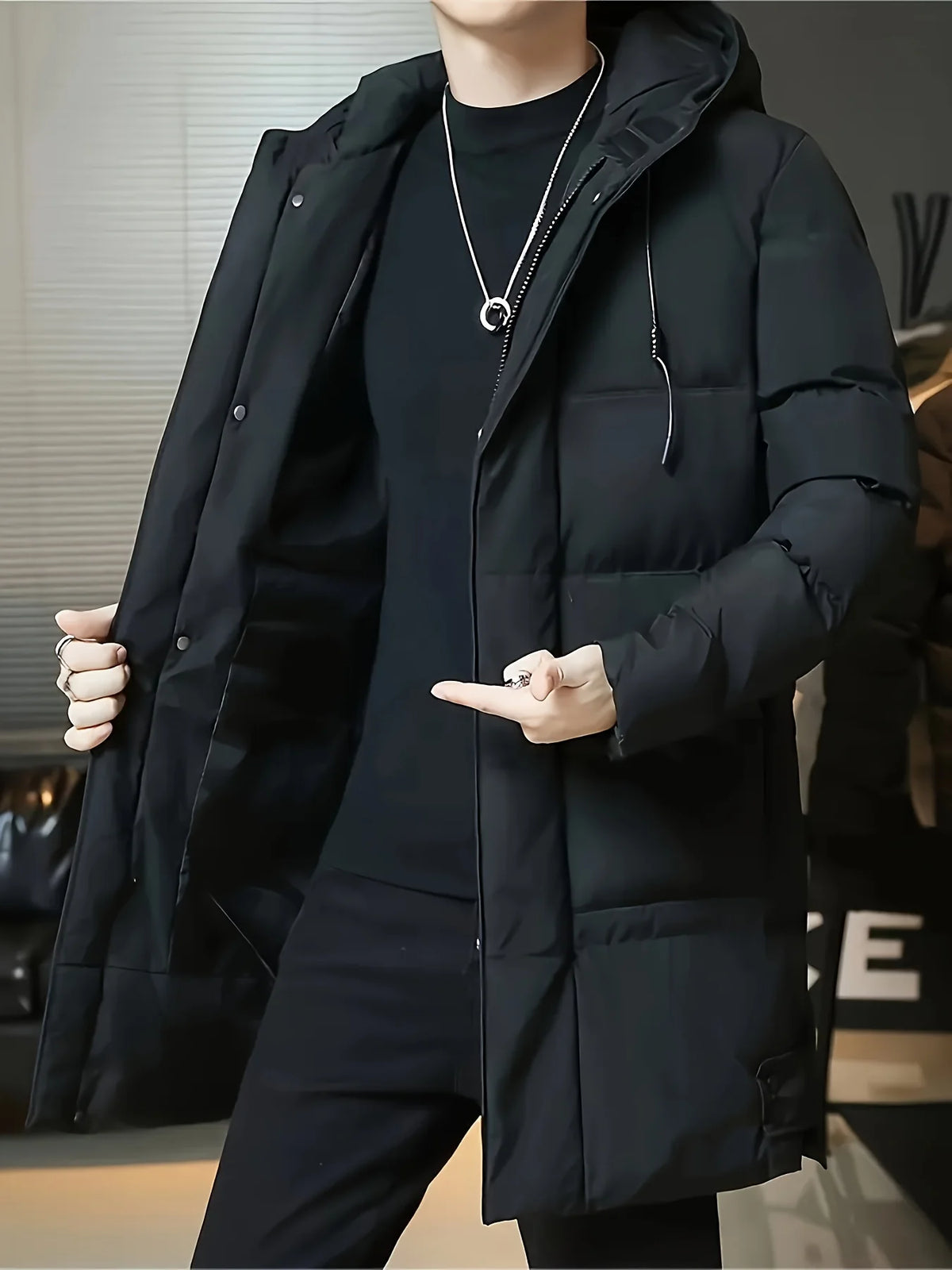 Men's black hooded longline puffer coat, zipped front view