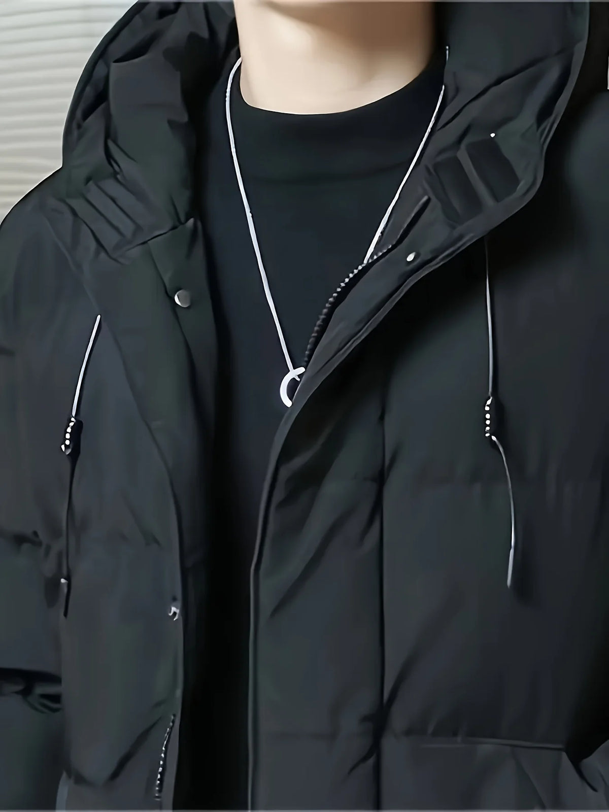 Men's black hooded longline puffer coat, zip and drawstring detail
