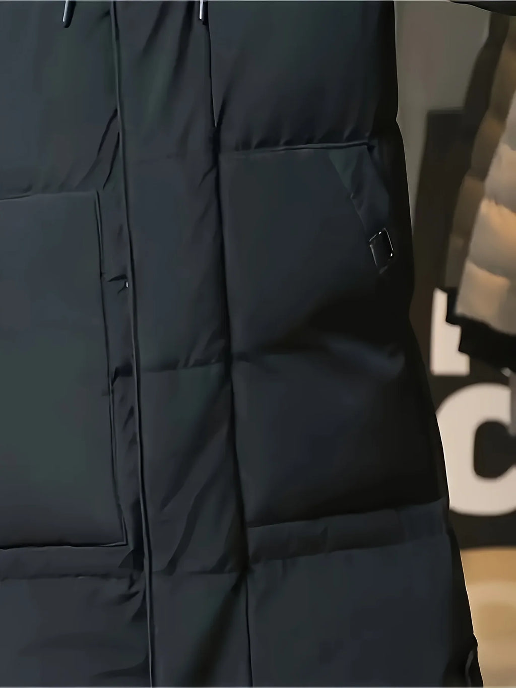 Men's black hooded longline puffer coat, side pocket and hem detail