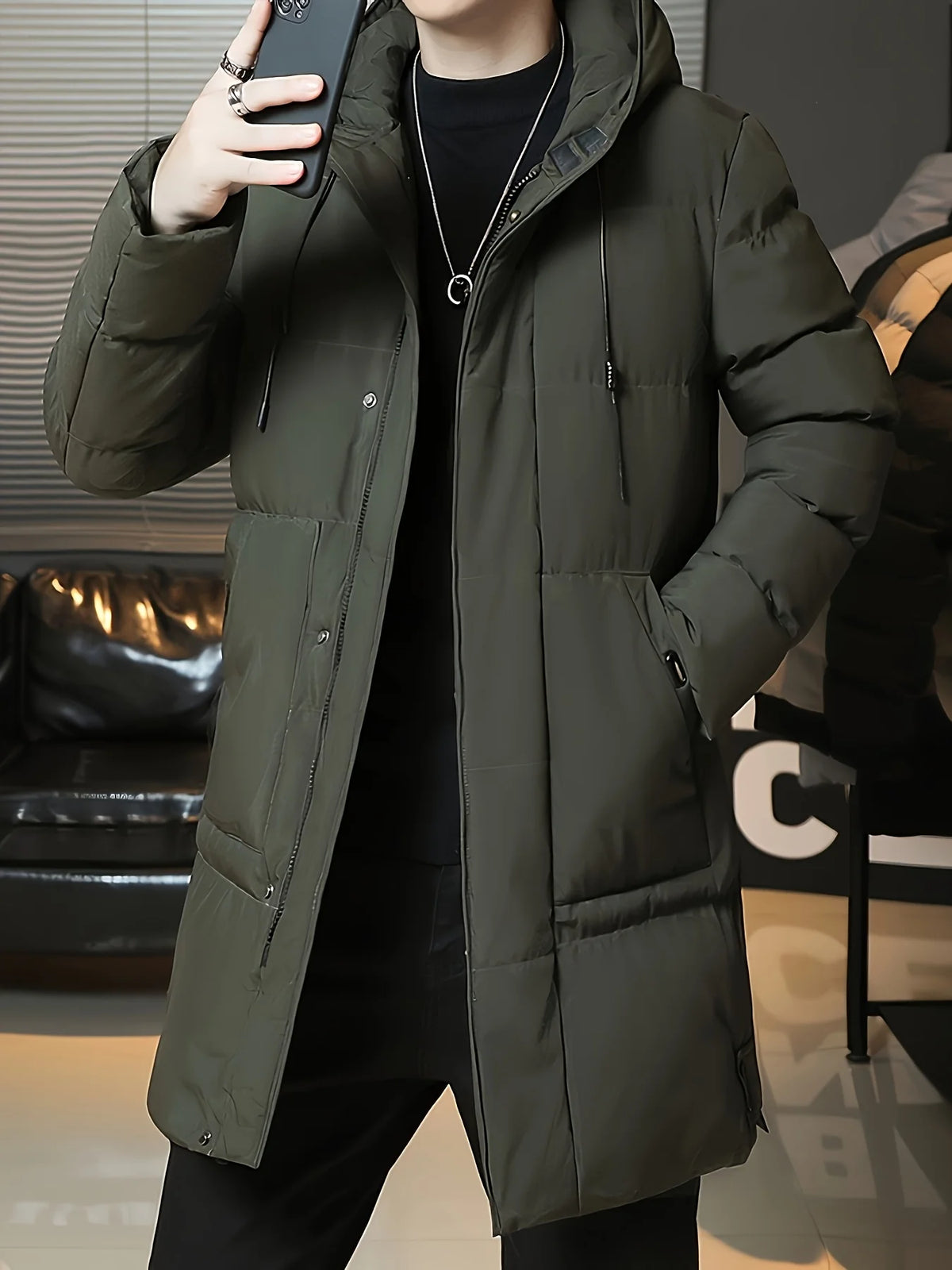 Men's green hooded longline puffer coat, hood and collar detail