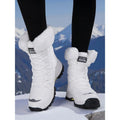 Women's white cozy insulated lace-up winter boots with pull-tab heel