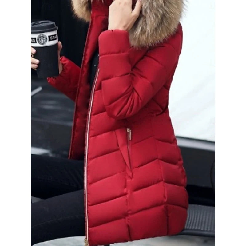 Women's red hooded puffer coat, close-up of zippered pocket