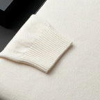Men's black ribbed mock neck sweater with dropped shoulders