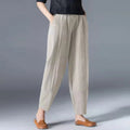 Women's beige tapered harem linen pants with an elastic waist