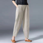 Women's beige tapered harem linen pants with an elastic waist