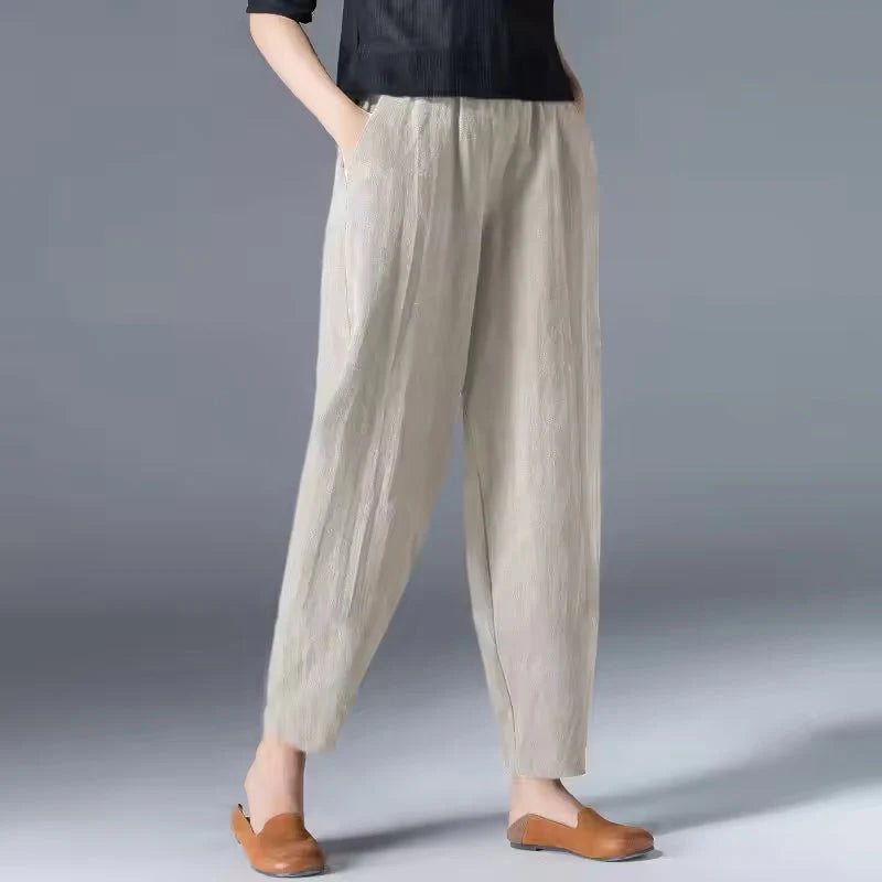 Women's beige tapered harem linen pants with an elastic waist