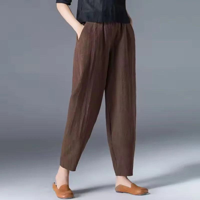 Women's brown tapered harem linen pants with an elastic waist