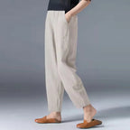 Women's gray tapered harem linen pants with an elastic waist