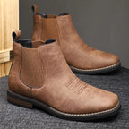 Men's black classic pull-on chelsea boots, with stretch side panels