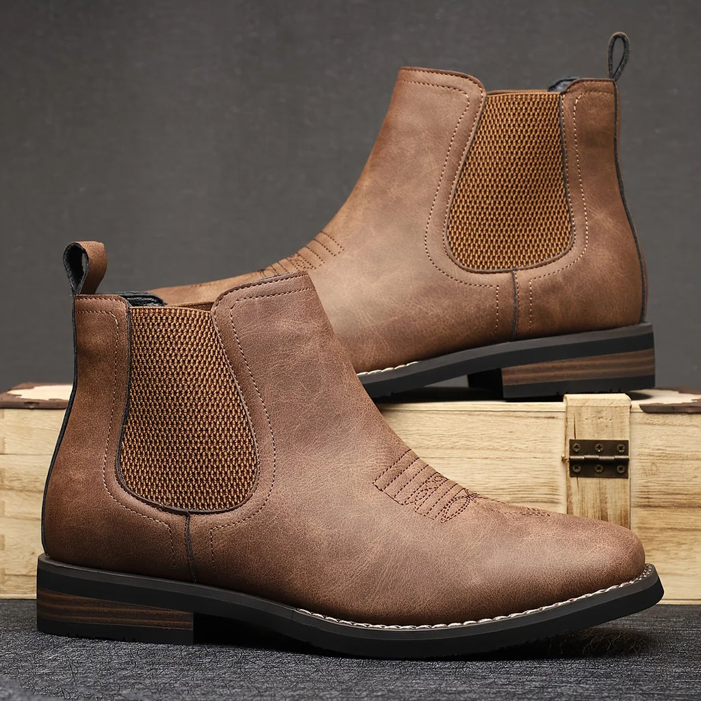 Men's black classic pull-on chelsea boots, with stretch side panels