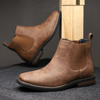 Men's black classic pull-on chelsea boots, with stretch side panels