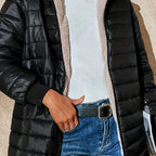 Women's black quilted longline puffer coat with relaxed silhouette